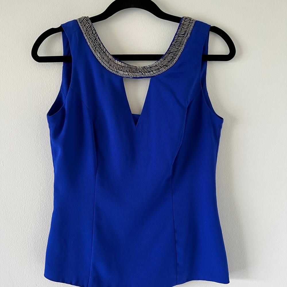 Beautiful elegant XOXO Top. Blue. New No tags